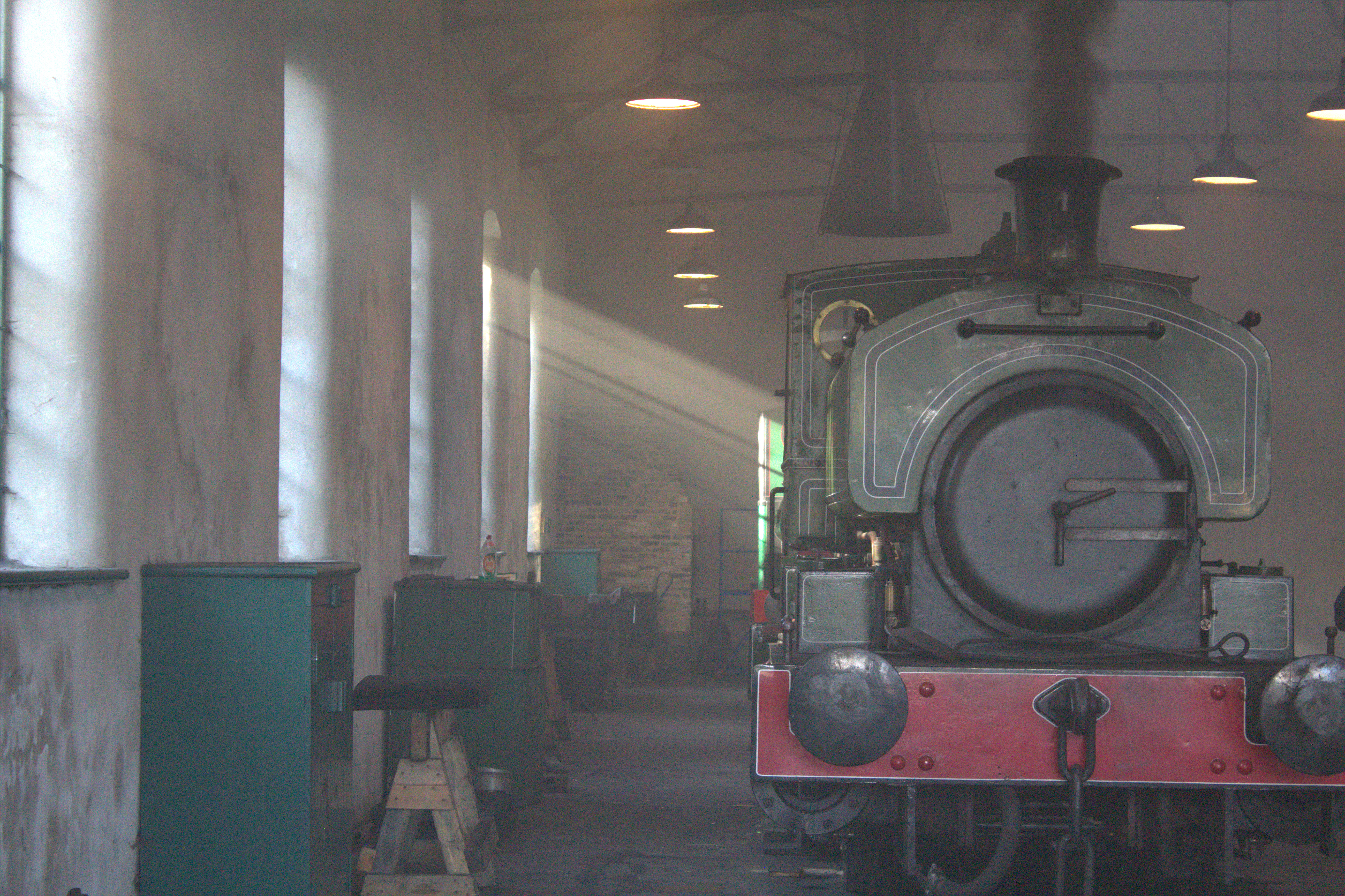 A steam locomotive aura farming in a shed full of smoke