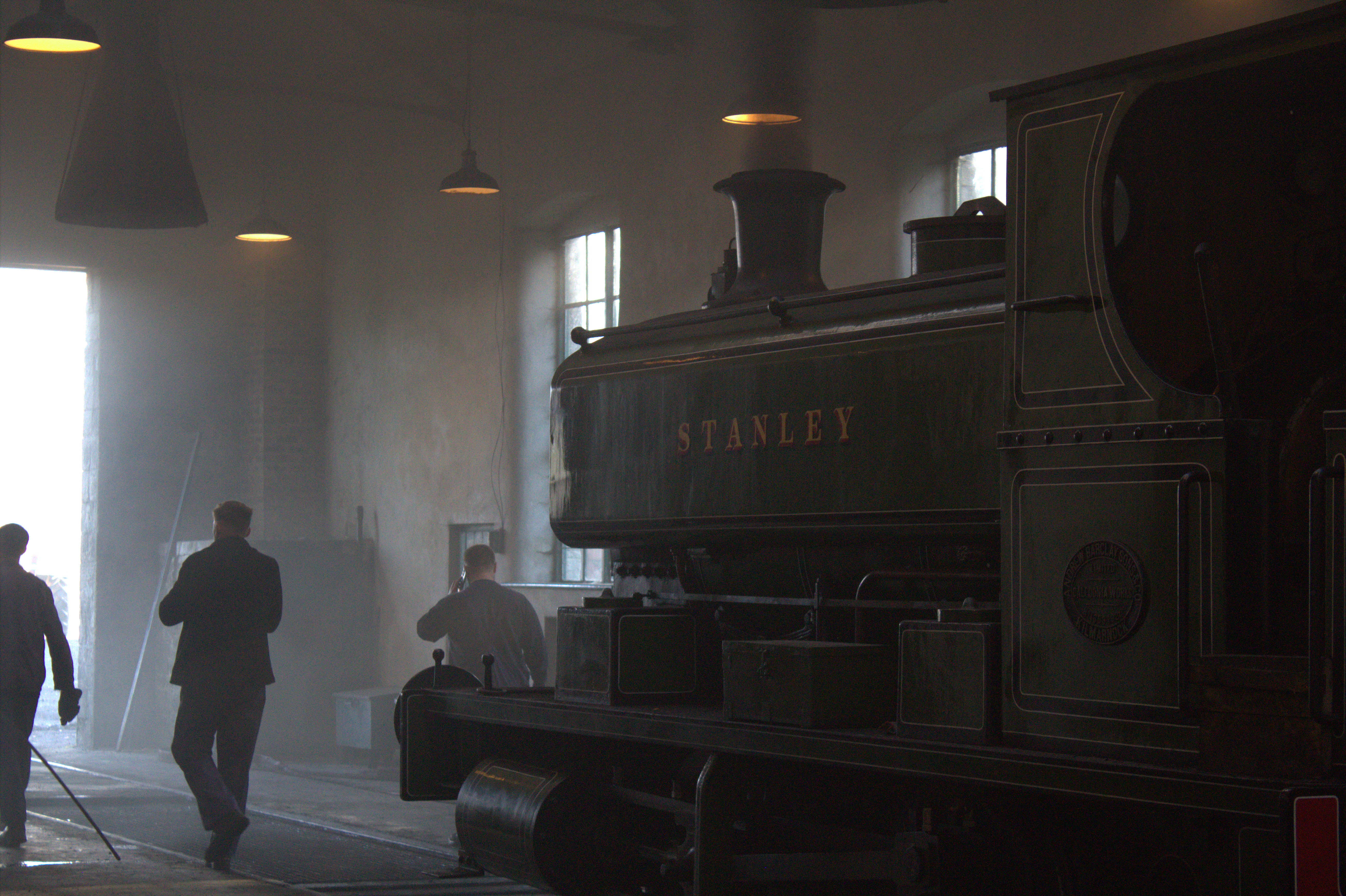 A steam locomotive aura farming in a shed full of smoke